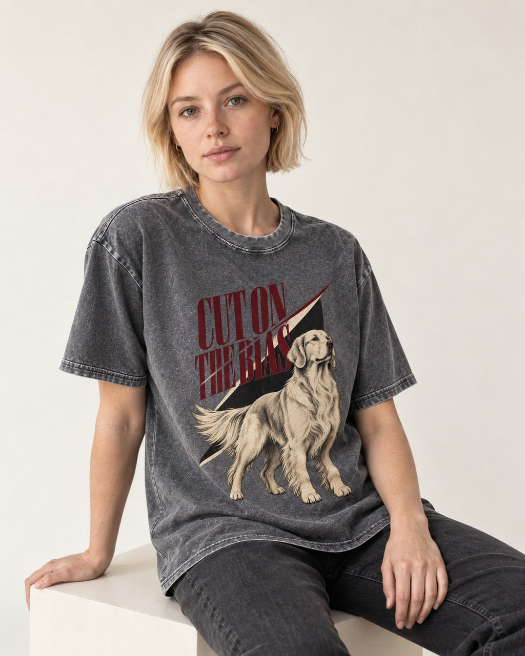 Cut on the Bias Golden Retriever Washed Tee in Gray, worn by a seated model