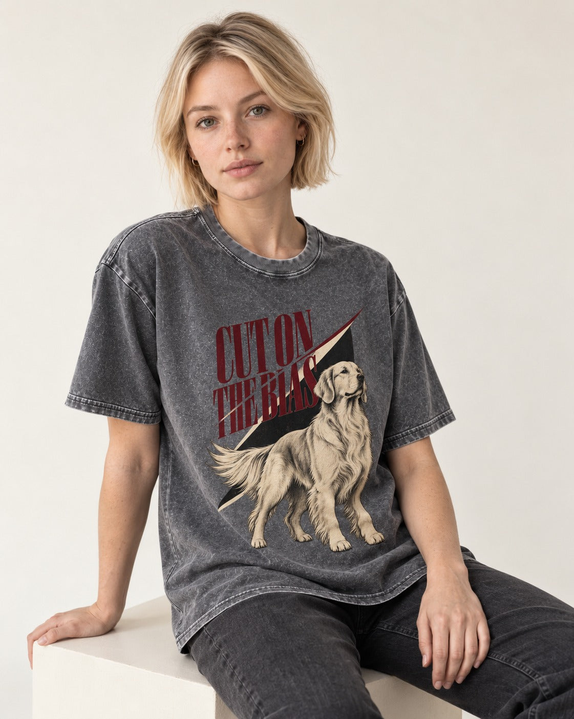 Cut on the Bias Golden Retriever Washed Tee in Gray, worn by a seated model