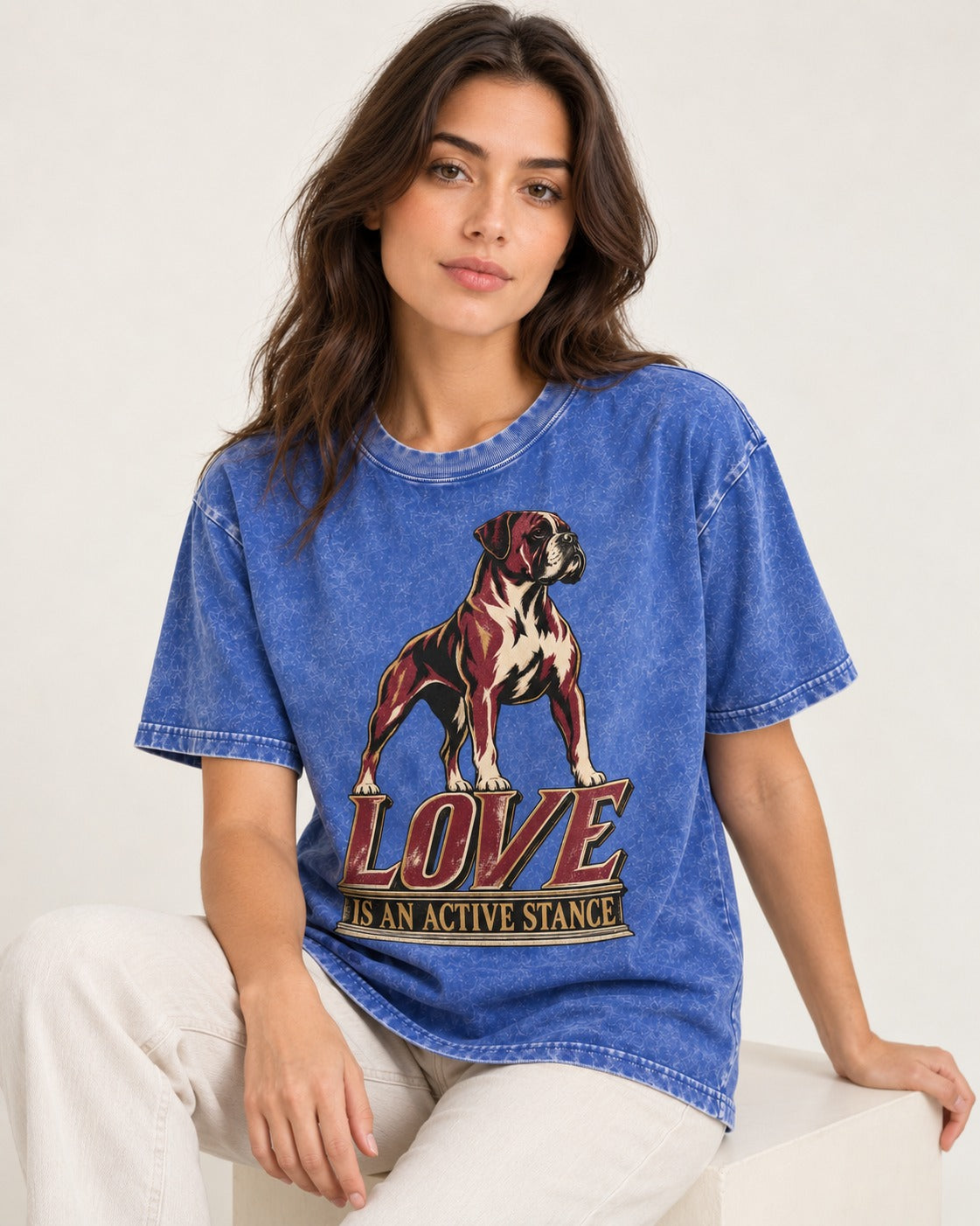 Love Is an Active Stance Boxer Pedestal Graphic Washed Tee in Royal Blue, worn by a seated model