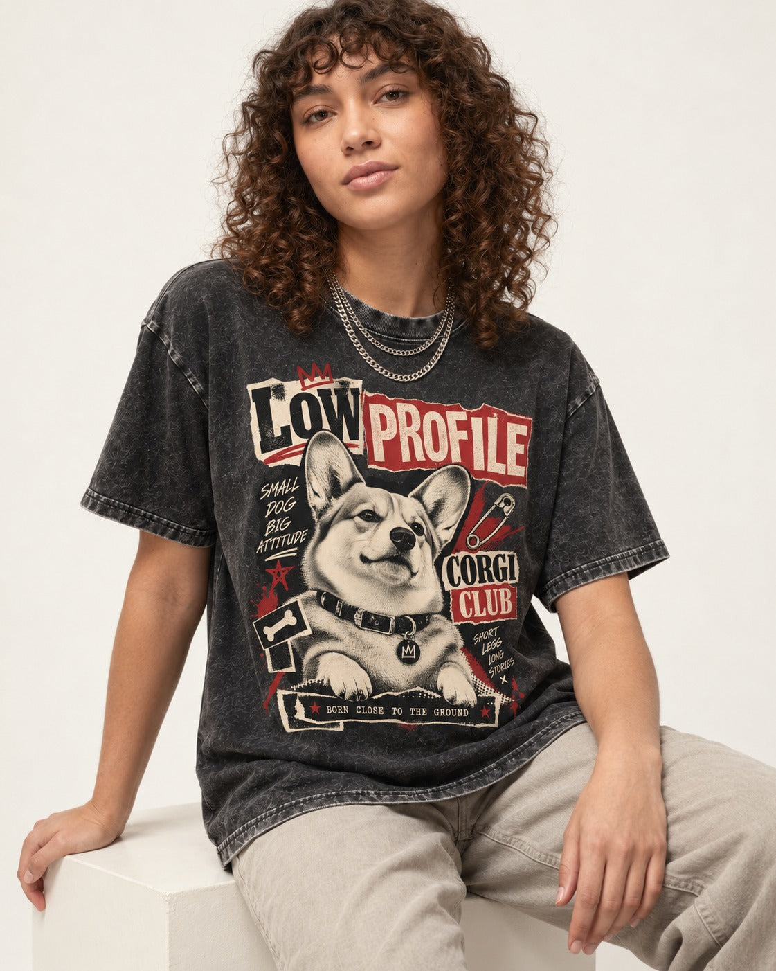 Corgi Low Profile Corgi Club Punk Collage Graphic Washed Tee in Black, worn by a seated model