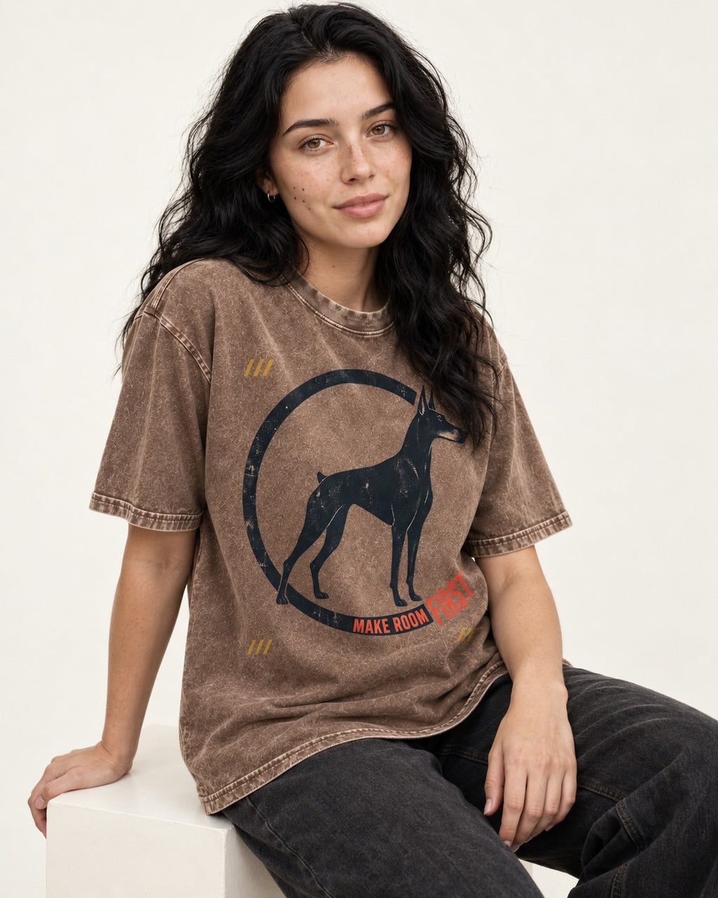 Make Room First Doberman Washed Tee in Coffee, worn by a seated model