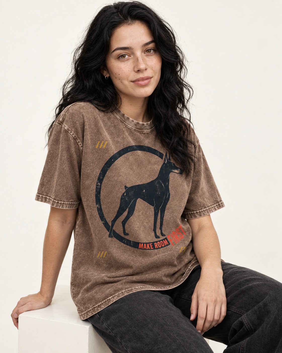 Make Room First Doberman Washed Tee in Coffee, worn by a seated model