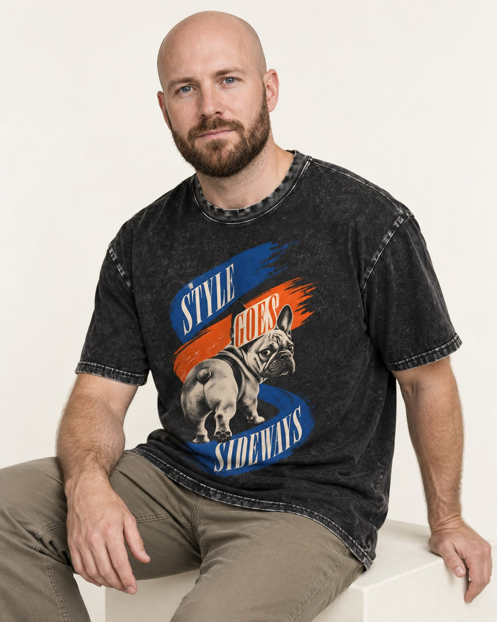Frenchie Style Goes Sideways Graphic Washed Tee in Black, worn by a seated model