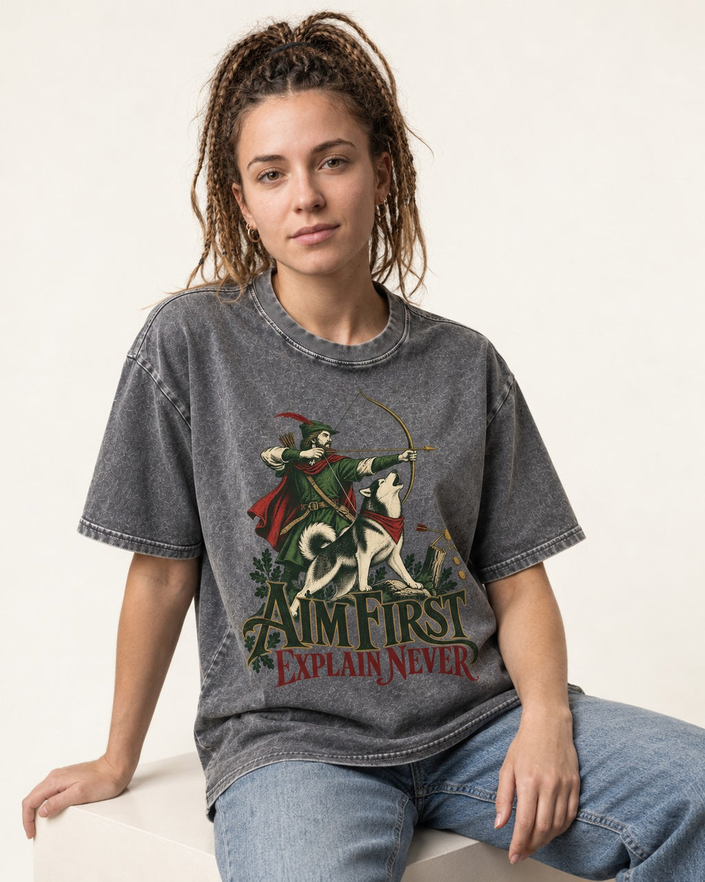 Husky Aim First Explain Never Washed Tee in Gray, worn by a seated model