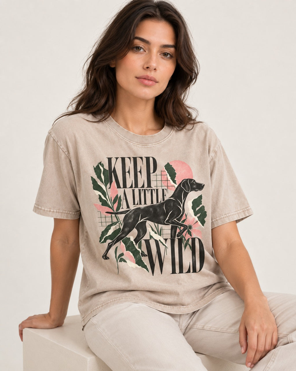 Keep a Little Wild German Shorthaired Pointer Washed Tee in Apricot, worn by a seated model