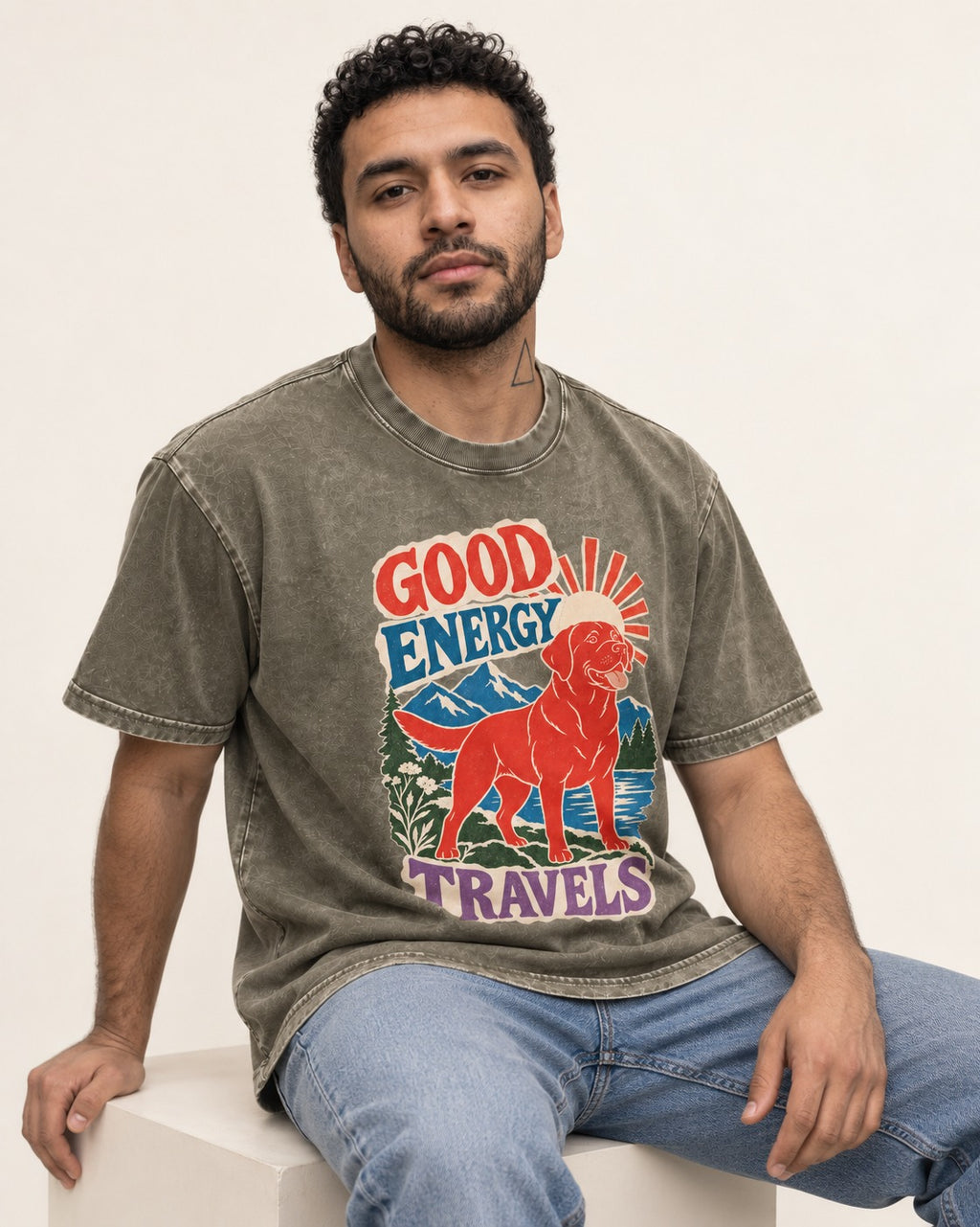 Labrador Retriever Good Energy Travels Adventure Graphic Washed Tee in Army Green, worn by a seated model