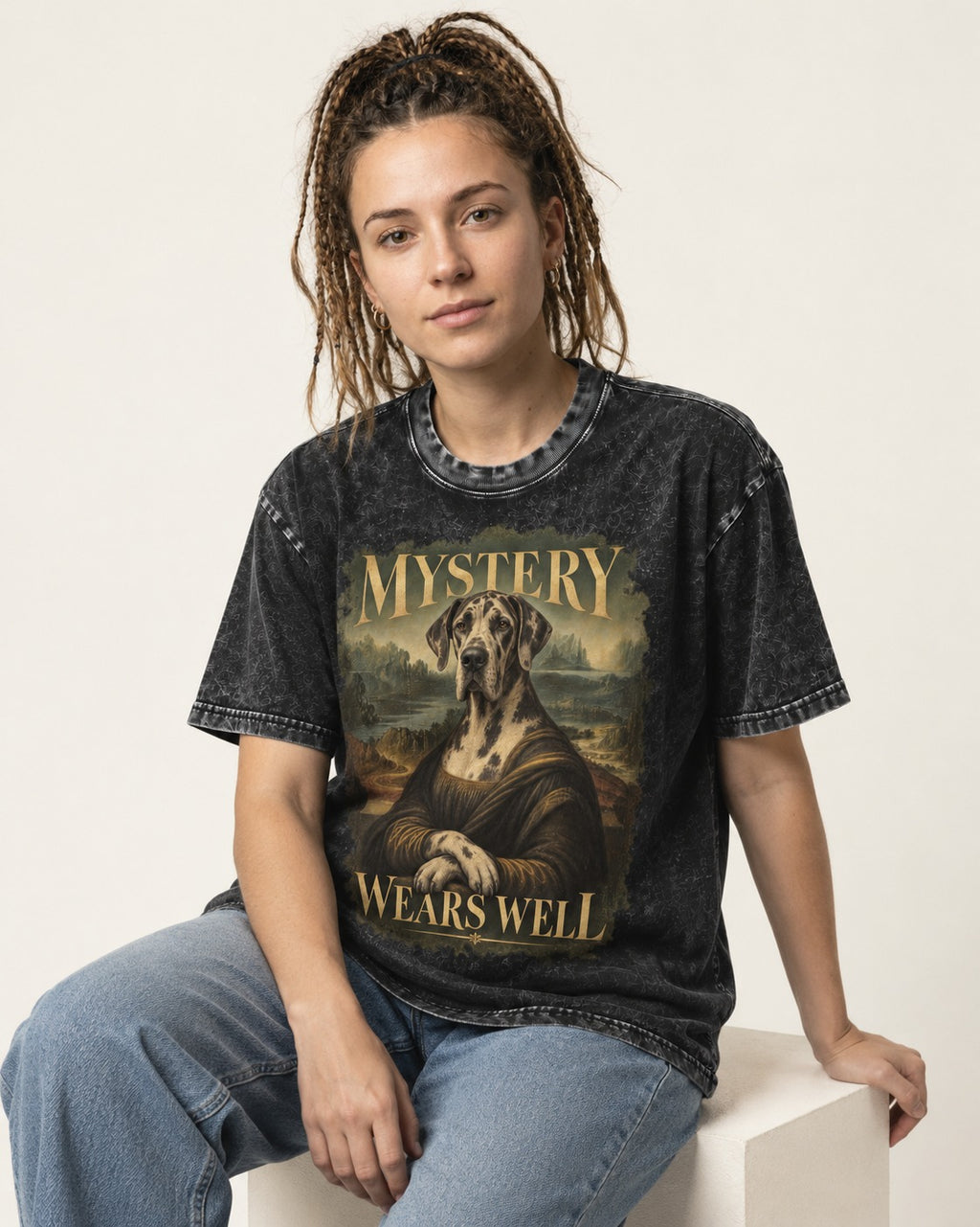 Great Dane Mystery Wears Well Renaissance Portrait Graphic Washed Tee in Black, worn by a seated model