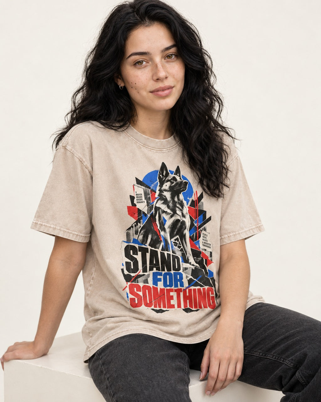 Stand For Something Brutalist Collage German Shepherd Dog Graphic Washed Tee in Apricot, worn by a seated model