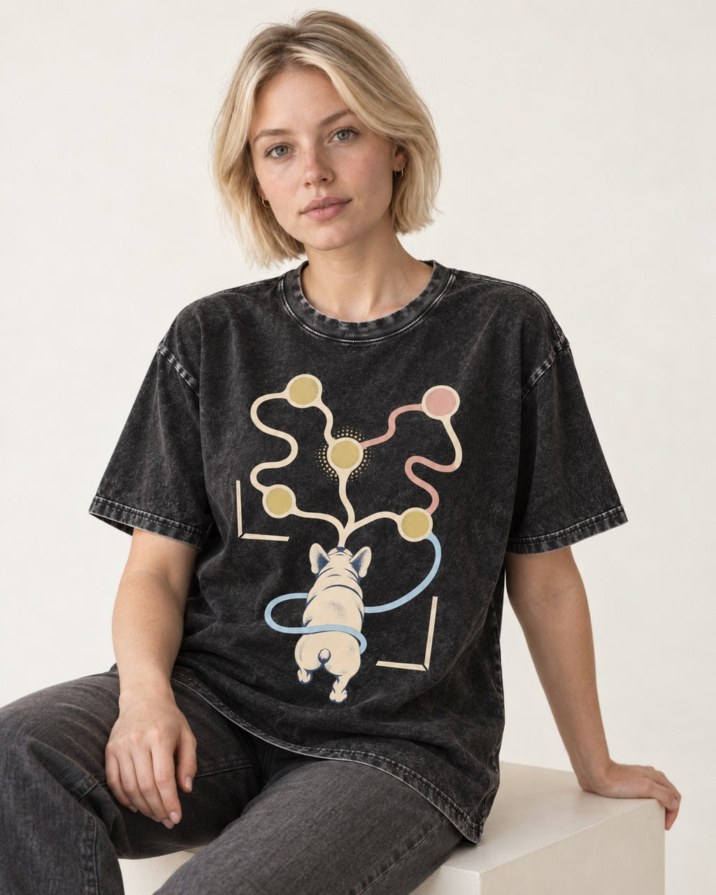 Frenchie Scent Circuit Rear View Graphic Washed Tee in Black, worn by a seated model