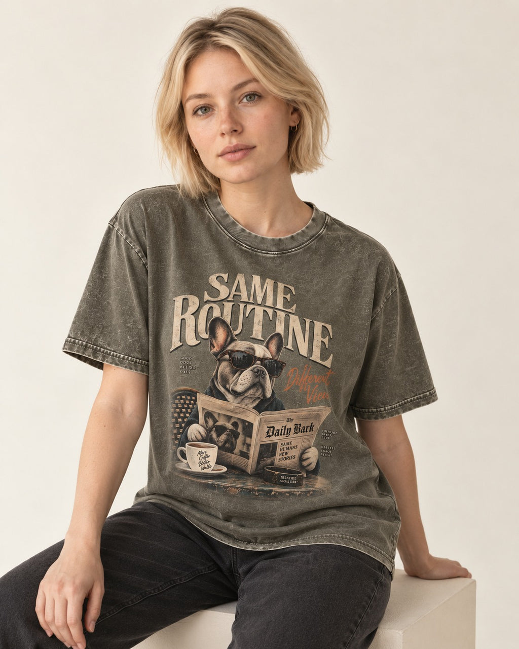 Frenchie Same Routine Different View Graphic Washed Tee in Army Green, worn by a seated model