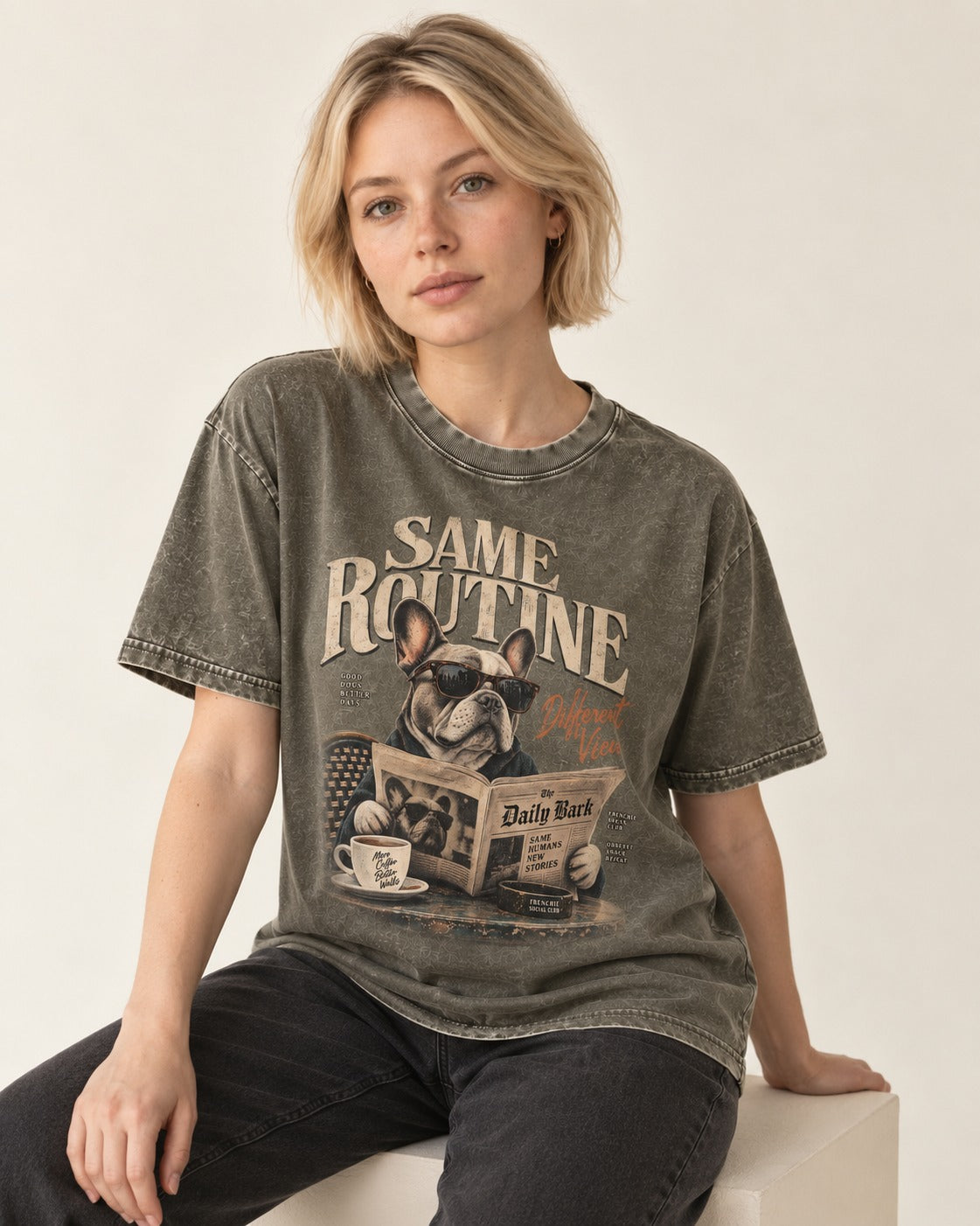 Frenchie Same Routine Different View Graphic Washed Tee in Army Green, worn by a seated model