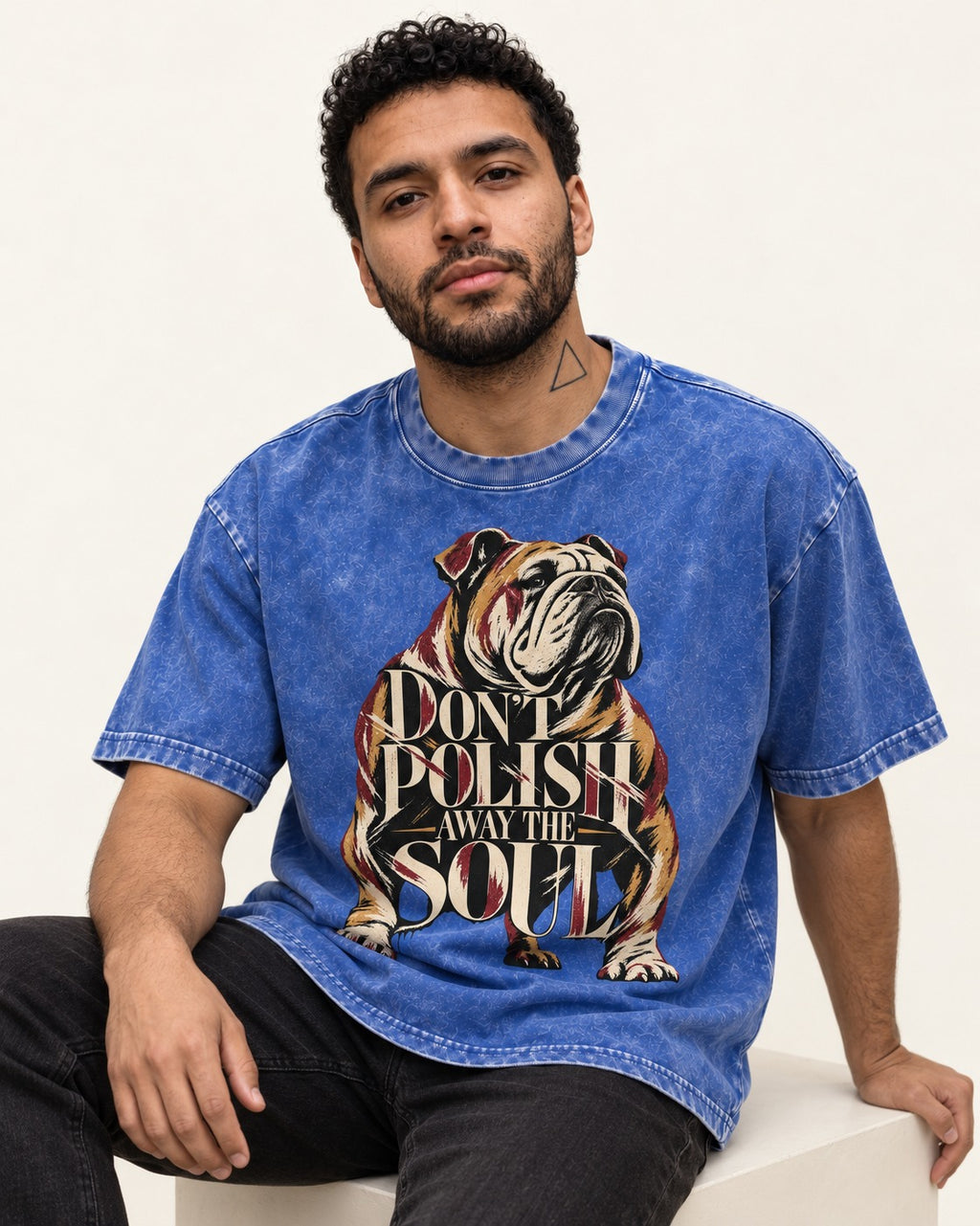 English Bulldog Don't Polish Away the Soul Typography Graphic Washed Tee in Royal Blue, worn by a seated model
