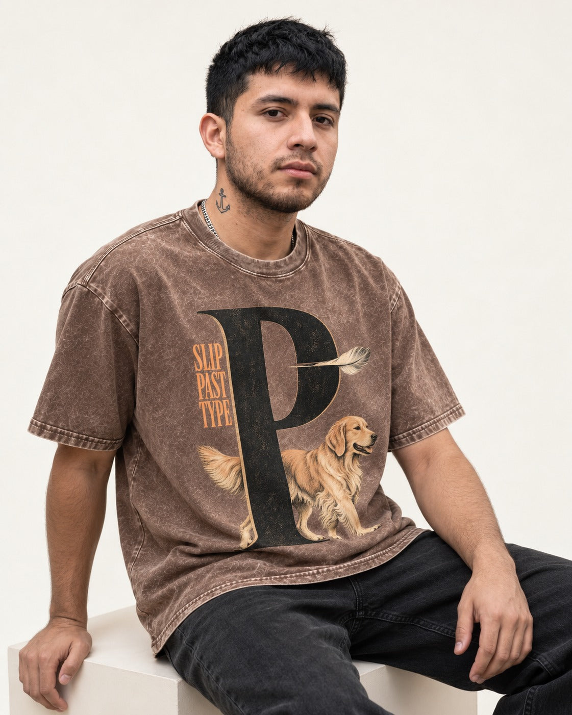 Golden Retriever Slip Past Type Washed Tee in Coffee, worn by a seated model
