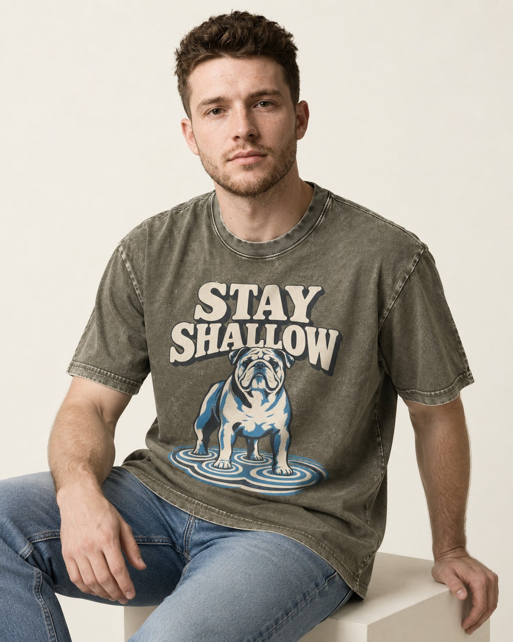 English Bulldog Stay Shallow Ripple Graphic Washed Tee in Army Green, worn by a seated model