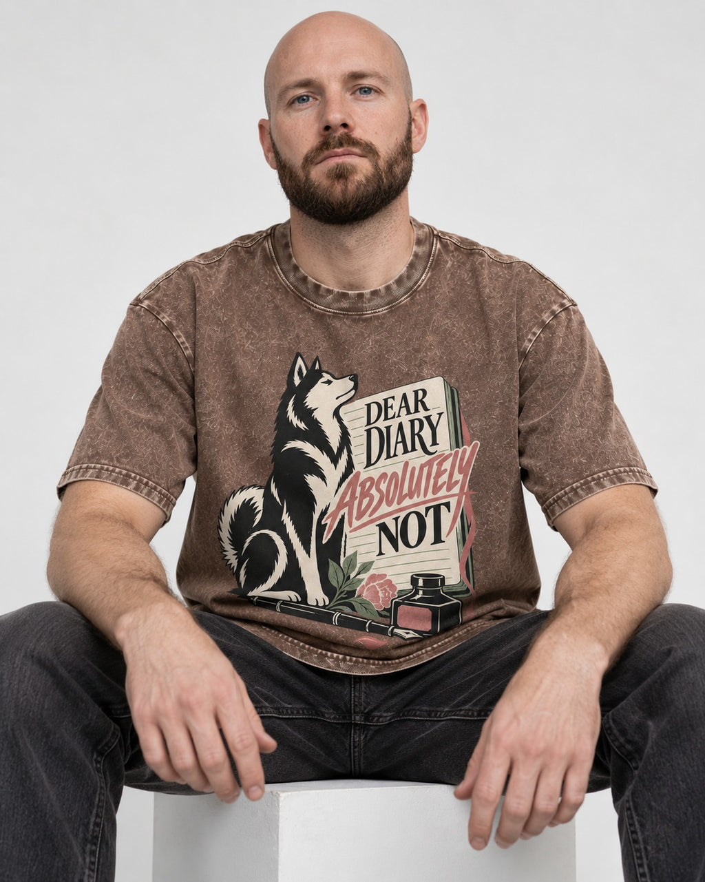 Husky Absolutely Not Washed Tee in Coffee, worn by a seated model