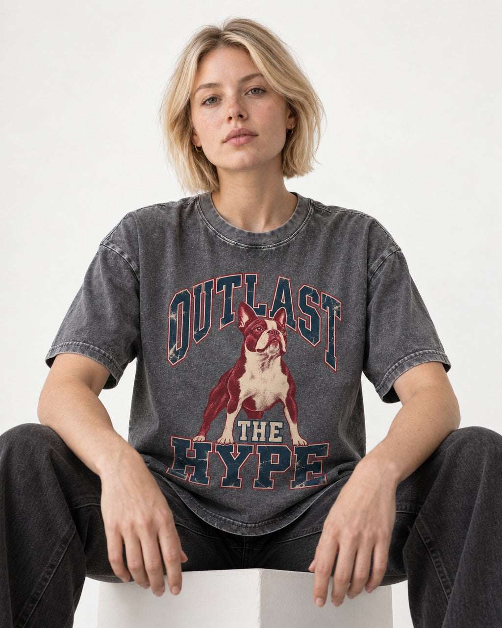 Boston Terrier Outlast The Hype Collegiate Graphic Washed Tee in Gray, worn by a seated model