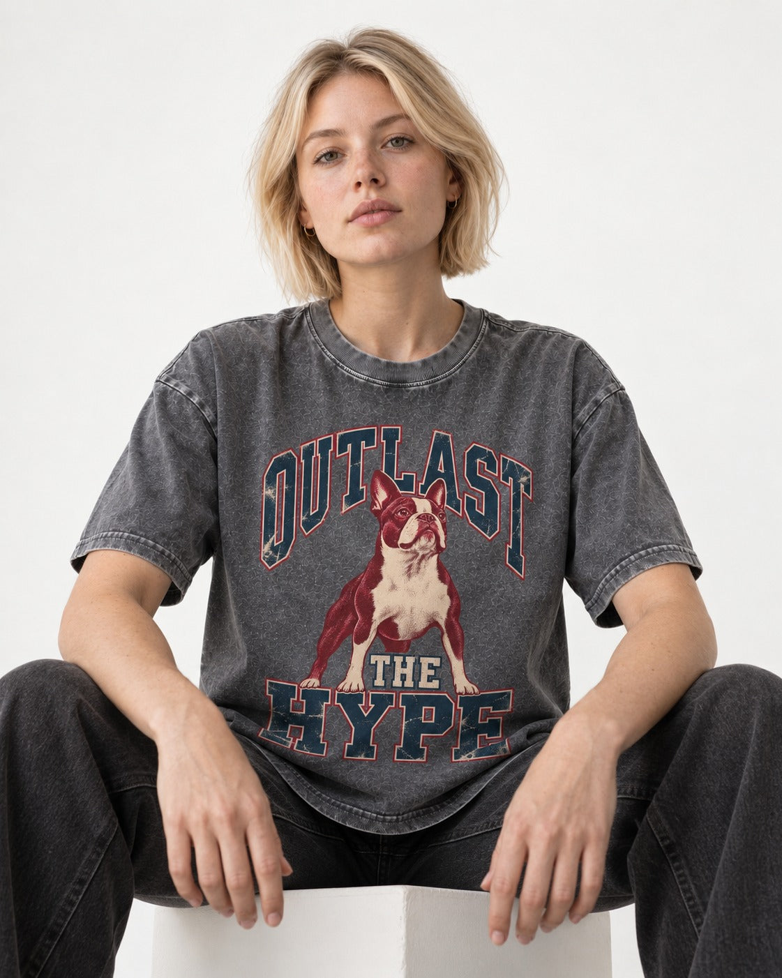 Boston Terrier Outlast The Hype Collegiate Graphic Washed Tee in Gray, worn by a seated model