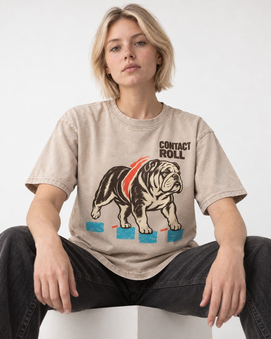 Contact Roll English Bulldog Washed Tee in Apricot, worn by a seated model