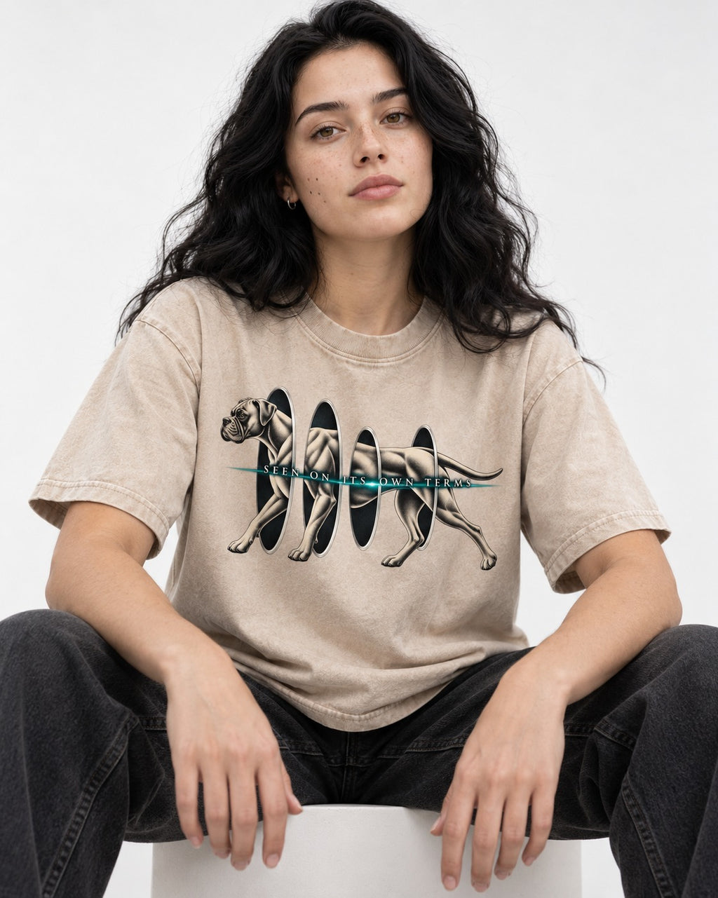 Boxer On Its Own Terms Washed Tee in Apricot, worn by a seated model