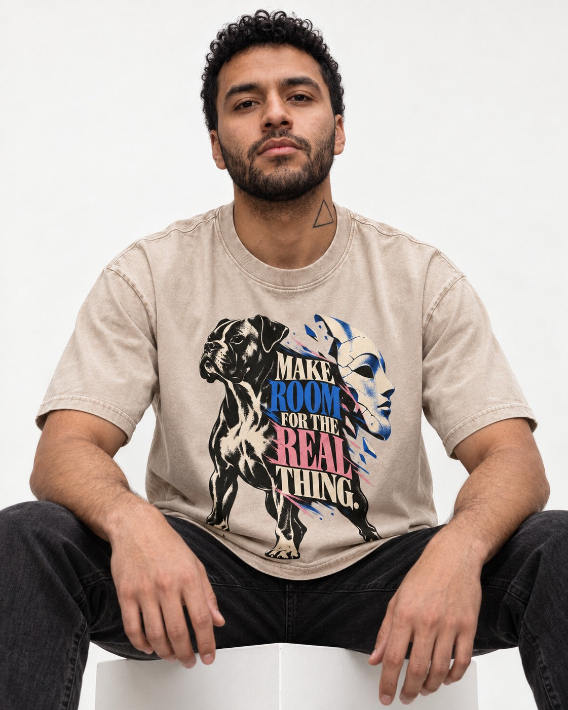 Make Room for the Real Thing Boxer Broken Mask Graphic Washed Tee in Apricot, worn by a seated model
