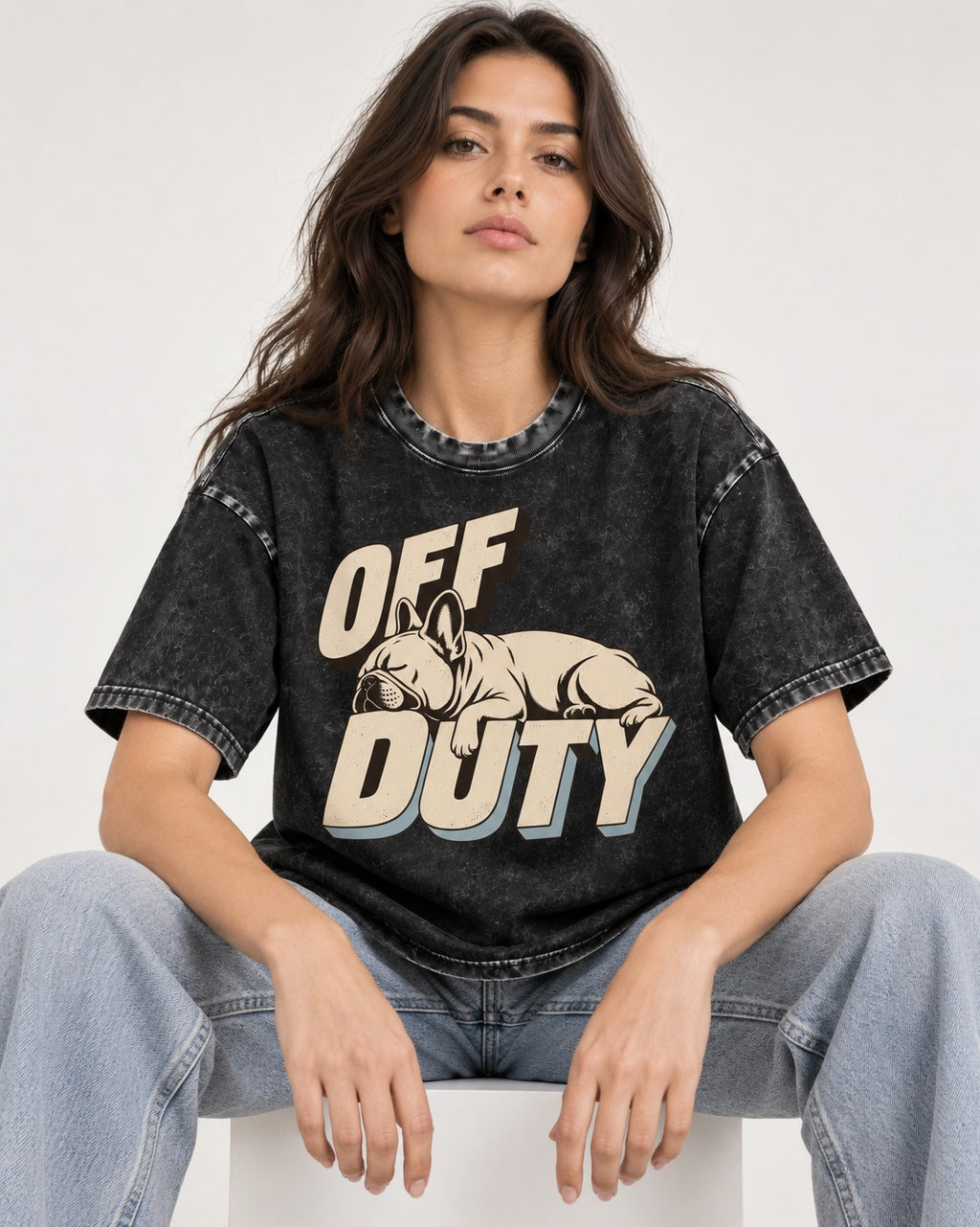 Frenchie Off Duty Sleeping Type Graphic Washed Tee in Black, worn by a seated model