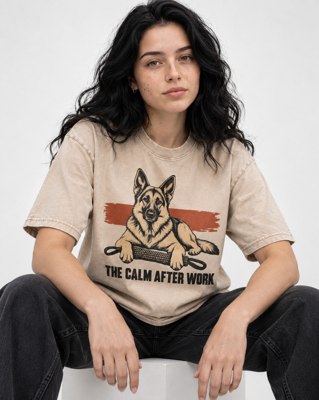 German Shepherd Dog The Calm After Work Washed Tee in Apricot, worn by a seated model