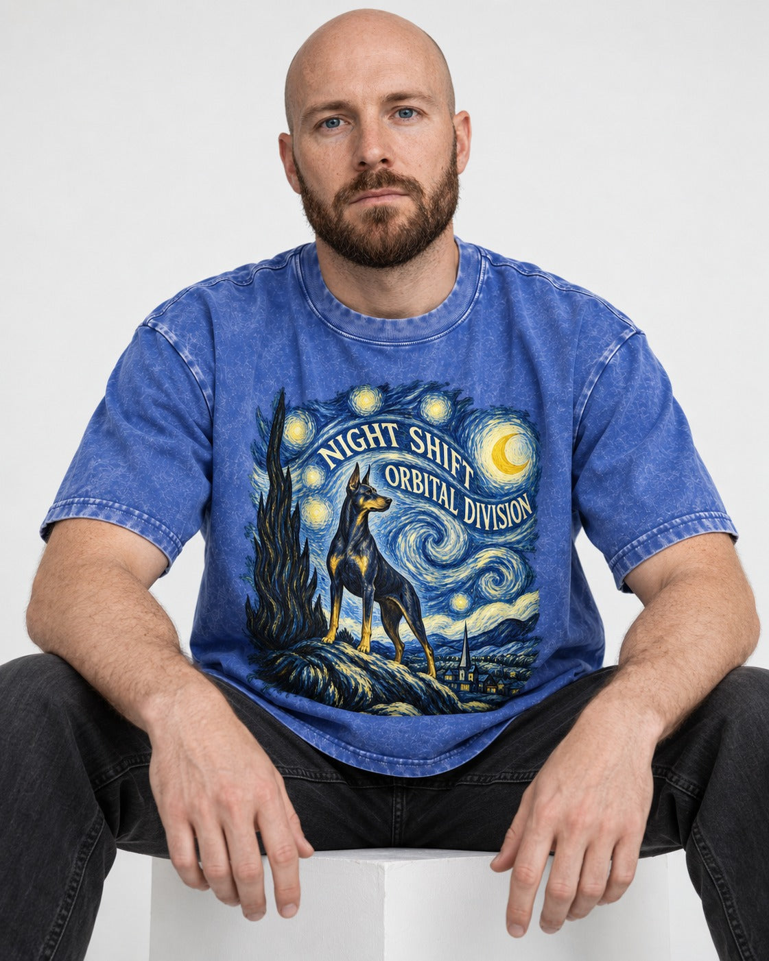 Doberman Night Shift Orbital Division Starry Night Graphic Washed Tee in Royal Blue, worn by a seated model