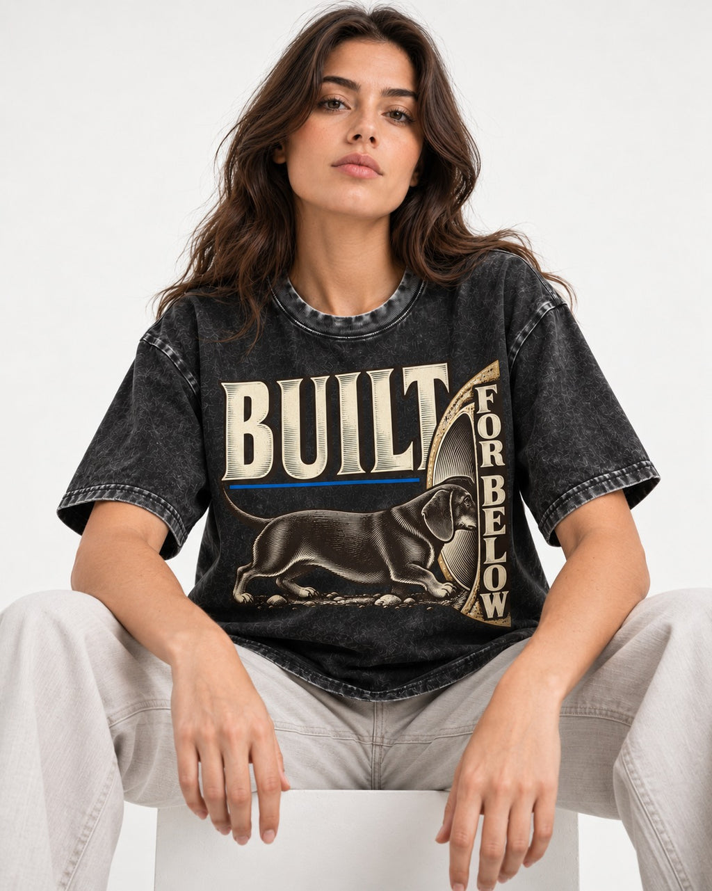Dachshund Built for Below Vintage Burrow Graphic Washed Tee in Black, worn by a seated model