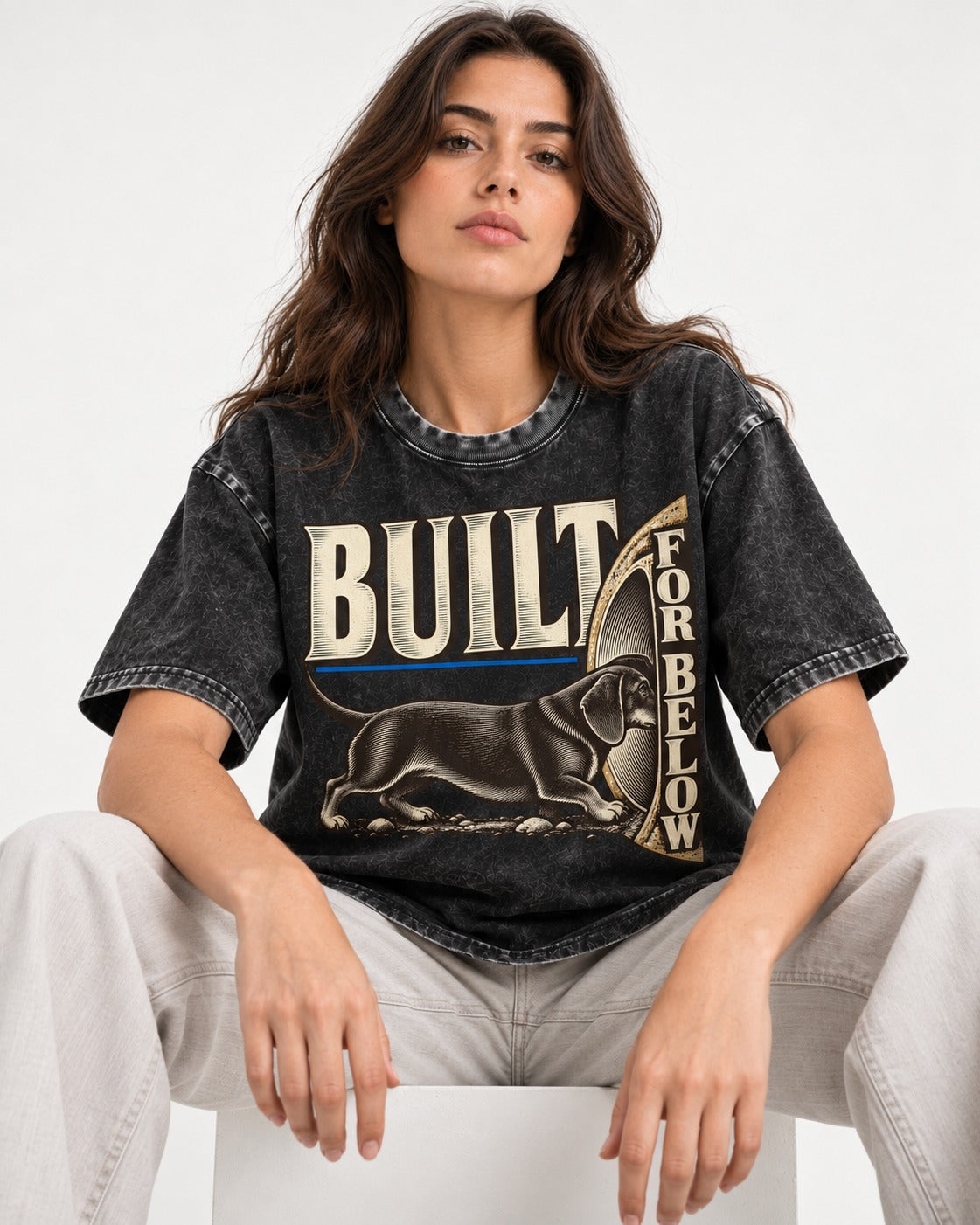 Dachshund Built for Below Vintage Burrow Graphic Washed Tee in Black, worn by a seated model