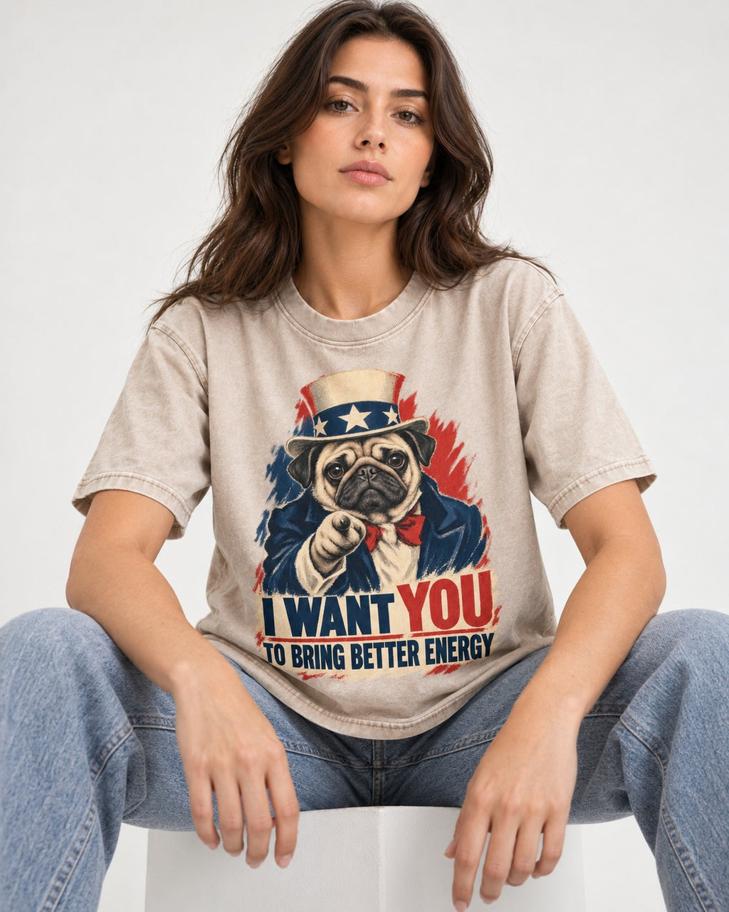 Pug I Want You to Bring Better Energy Uncle Sam Graphic Washed Tee in Apricot, worn by a seated model