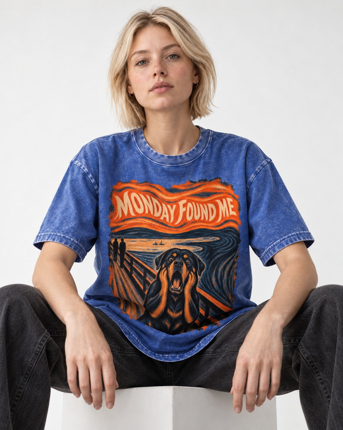 Rottweiler Monday Found Me Scream Parody Graphic Washed Tee in Royal Blue, worn by a seated model