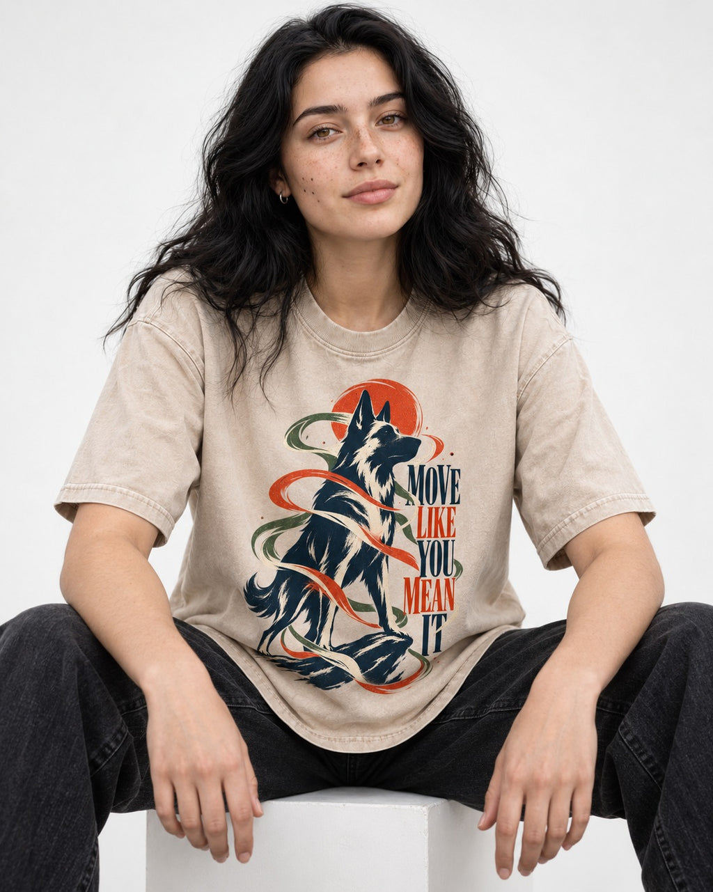 German Shepherd Dog Mean It Washed Tee in Apricot, worn by a seated model
