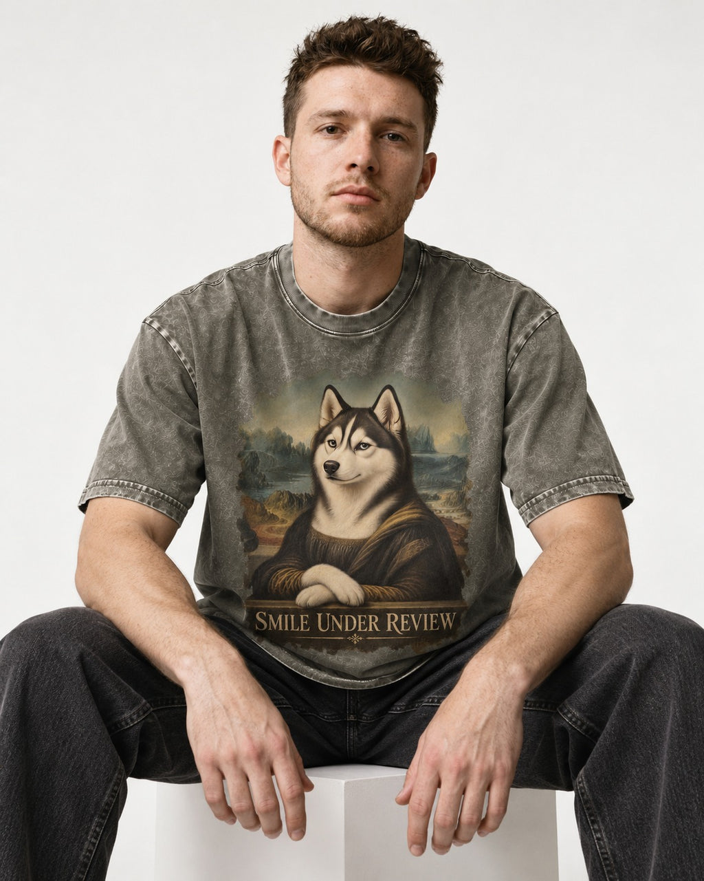 Husky Smile Under Review Renaissance Portrait Graphic Washed Tee in Army Green, worn by a seated model