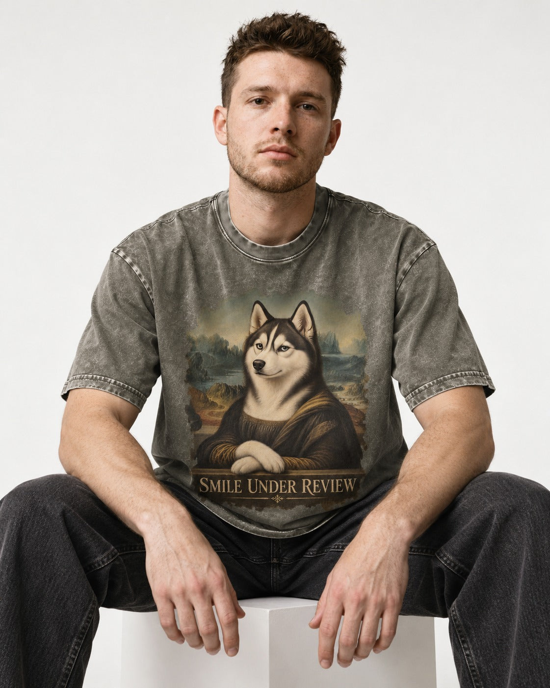 Husky Smile Under Review Renaissance Portrait Graphic Washed Tee in Army Green, worn by a seated model
