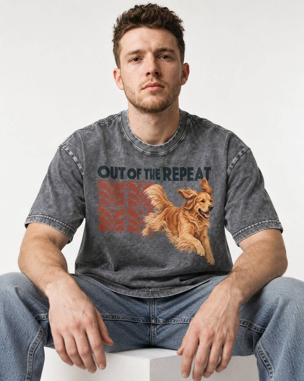 Golden Retriever Out of the Repeat Washed Tee in Gray, worn by a seated model