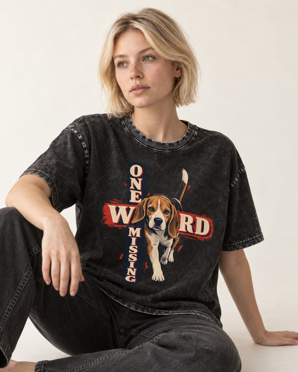Beagle One Word Missing Washed Tee in Black, worn by a seated model