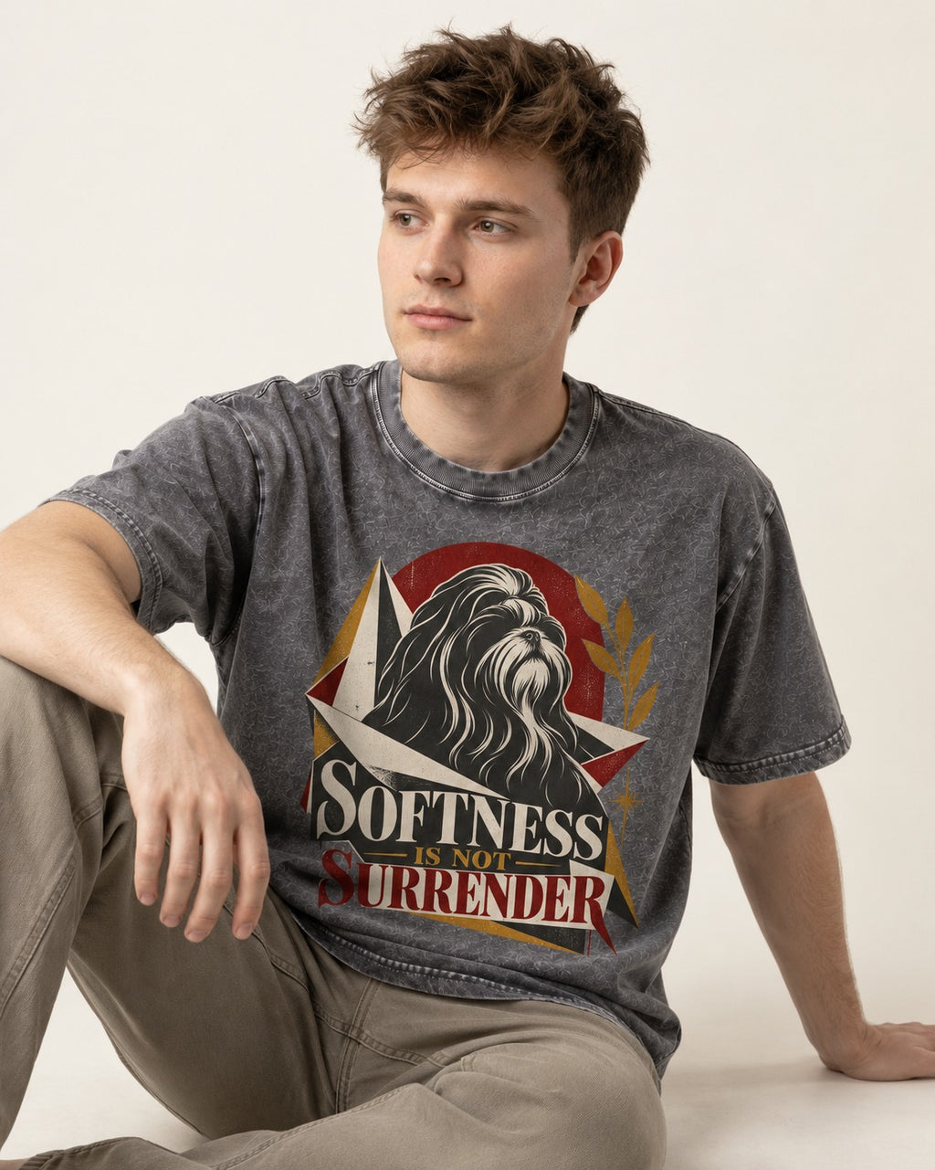 Shih Tzu Softness Is Not Surrender Washed Tee in Gray, worn by a seated model