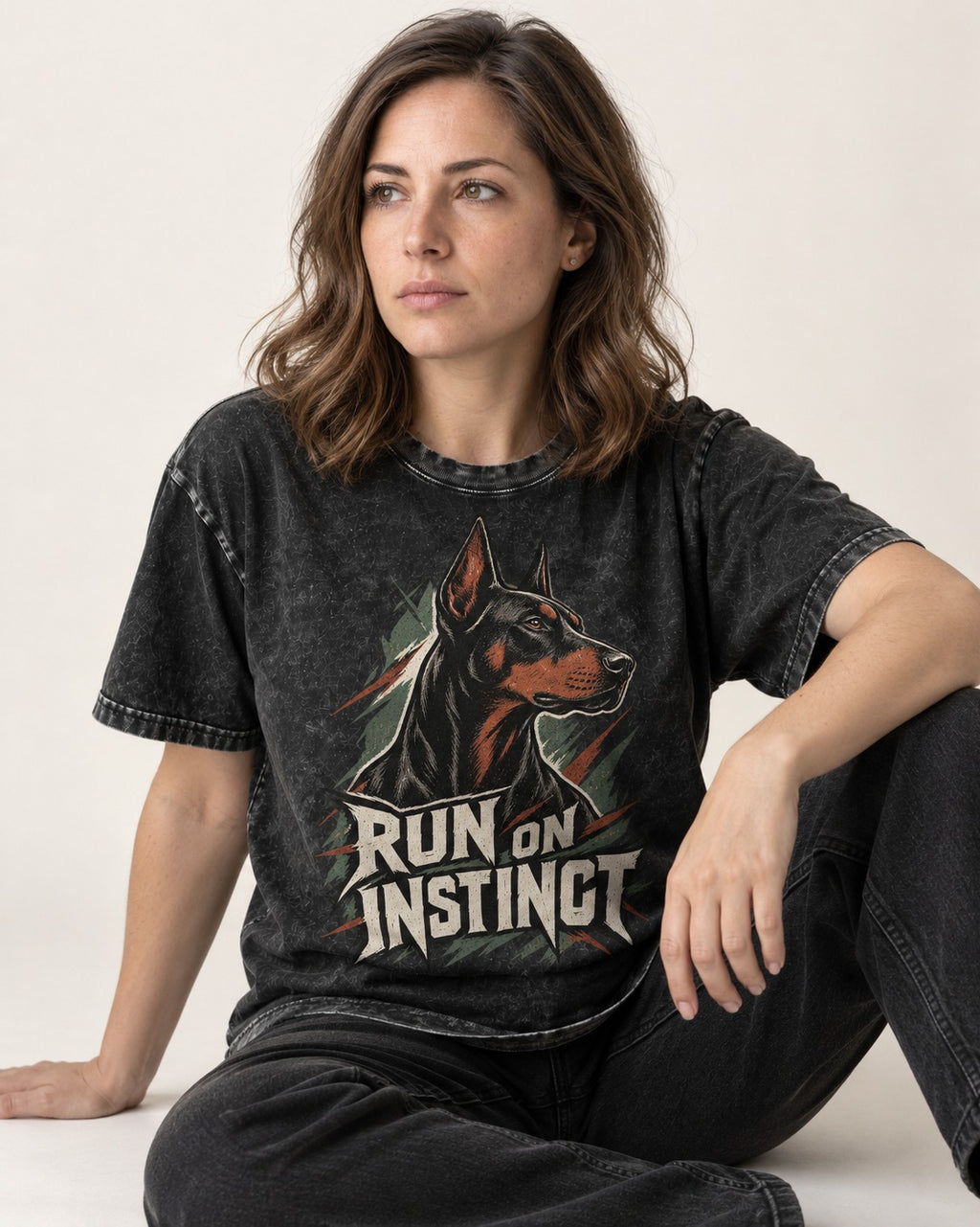 Doberman Run on Instinct Brush Slash Graphic Washed Tee in Black, worn by a seated model