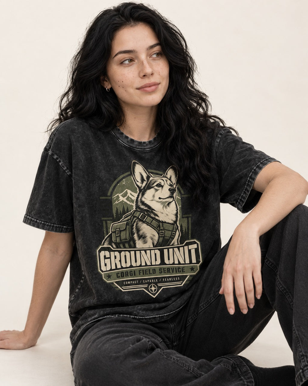 Corgi Ground Unit Field Service Badge Washed Tee in Black, worn by a seated model