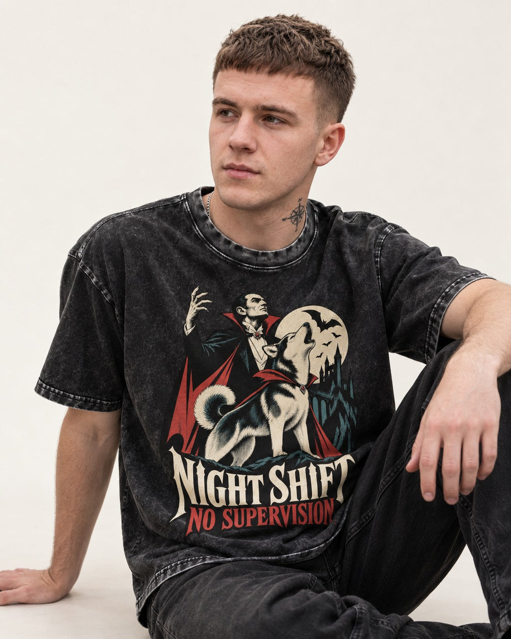 Husky Night Shift No Supervision Vampire Graphic Washed Tee in Black, worn by a seated model
