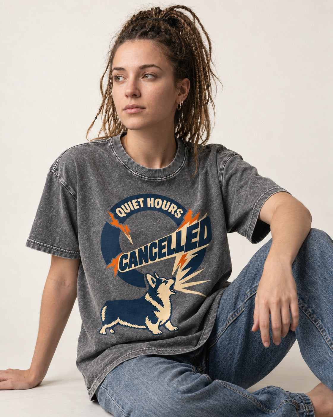 Corgi Quiet Hours Cancelled Calling Badge Graphic Washed Tee in Gray, worn by a seated model