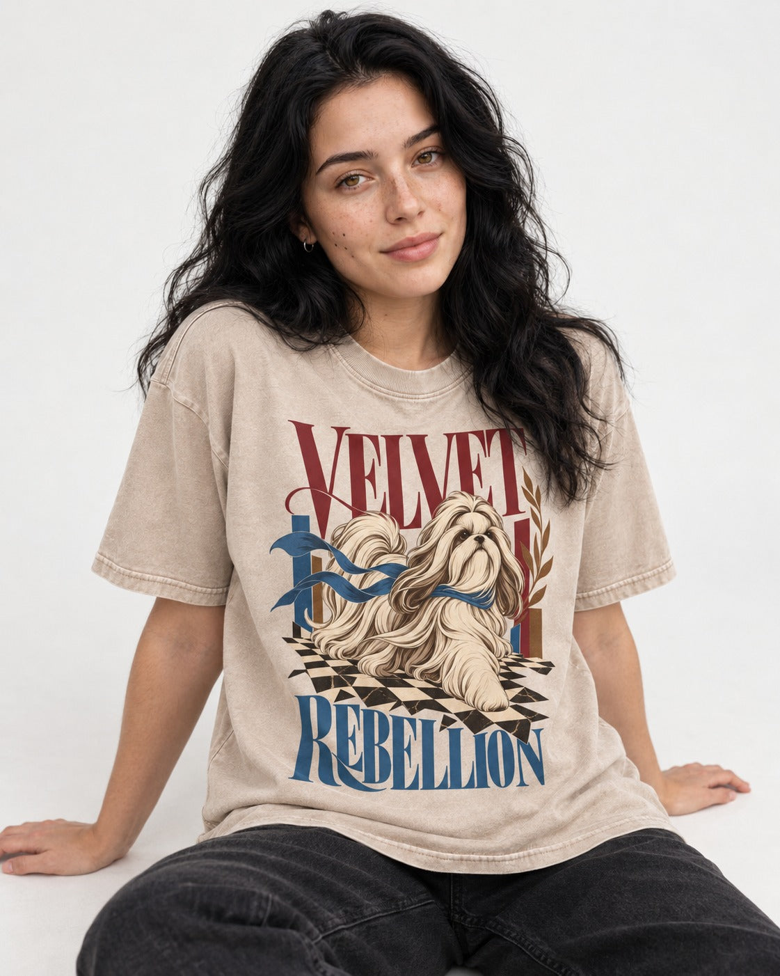 Shih Tzu Velvet Rebellion Checkerboard Graphic Washed Tee in Apricot, worn by a seated model