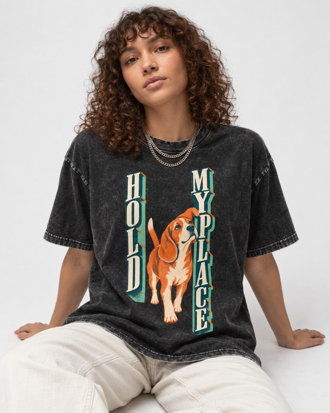 Vintage Beagle Hold My Place Washed Tee in Black, worn by a seated model