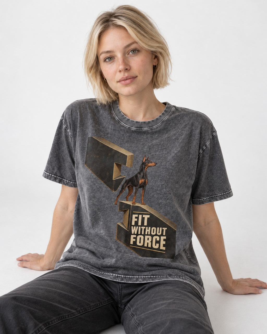 Doberman Fit Without Force Washed Tee in Gray, worn by a seated model