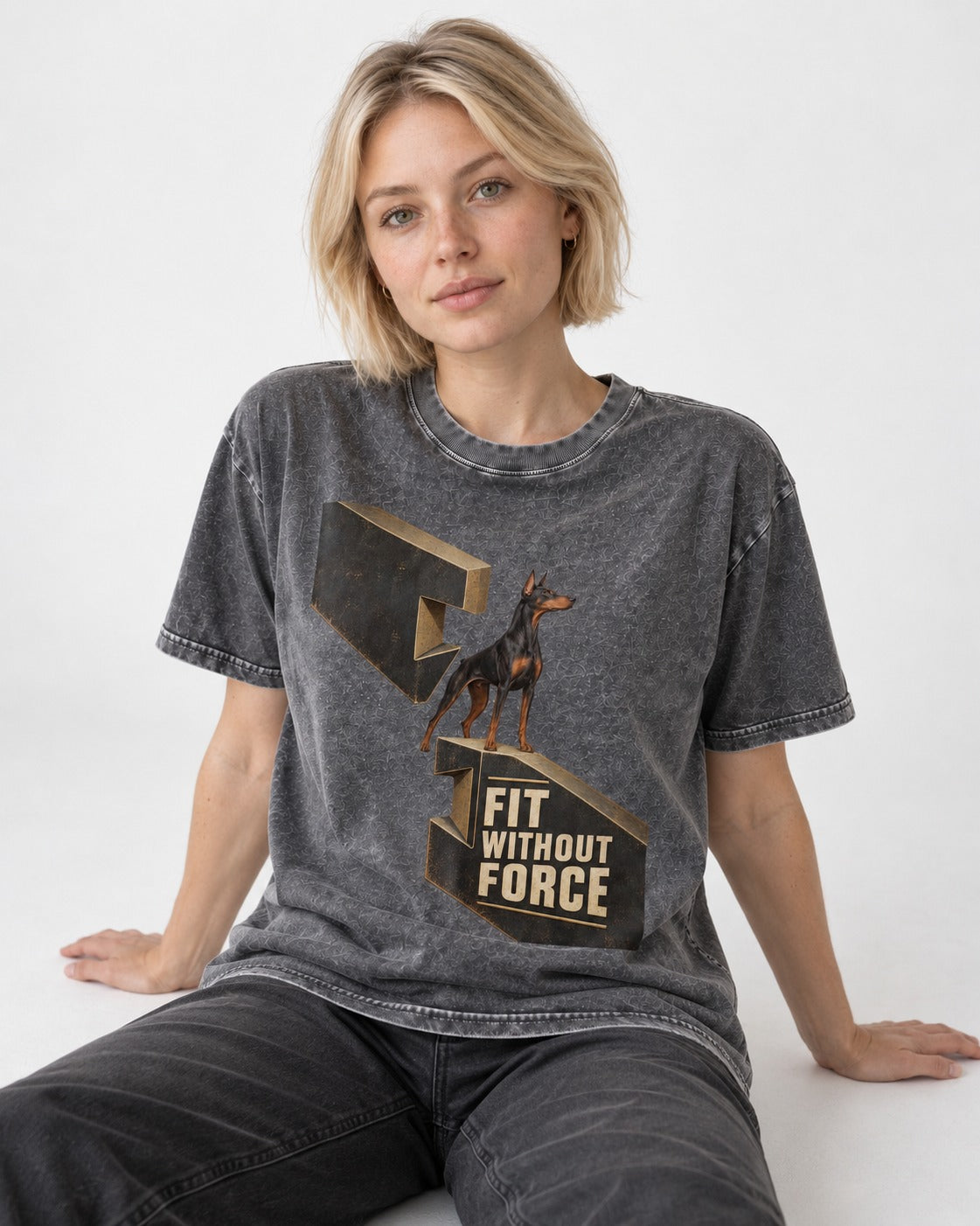 Doberman Fit Without Force Washed Tee in Gray, worn by a seated model