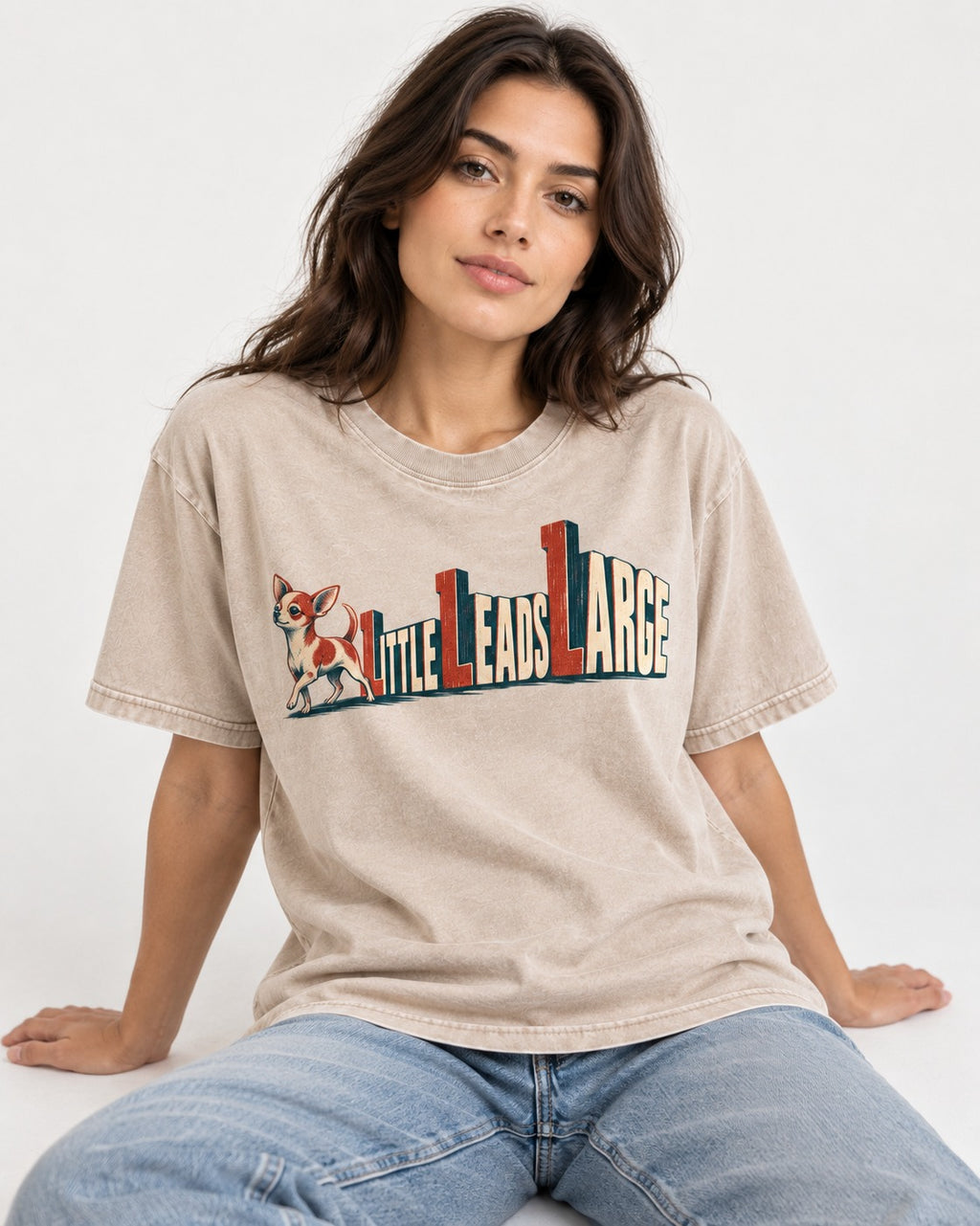 Chihuahua Little Leads Large Perspective Typography Washed Tee in Apricot, worn by a seated model