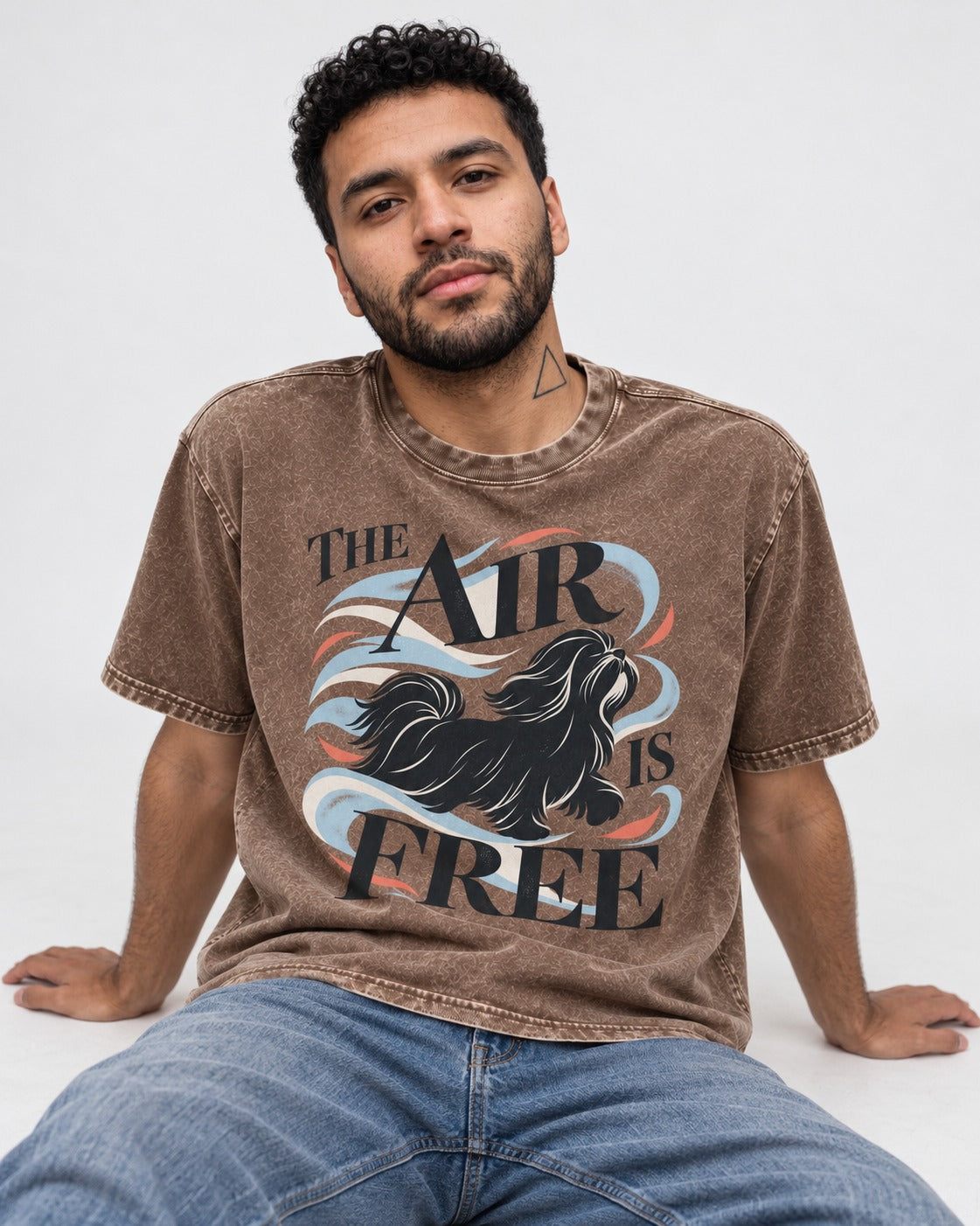 The Air Is Free Shih Tzu Washed Tee in Coffee, worn by a seated model
