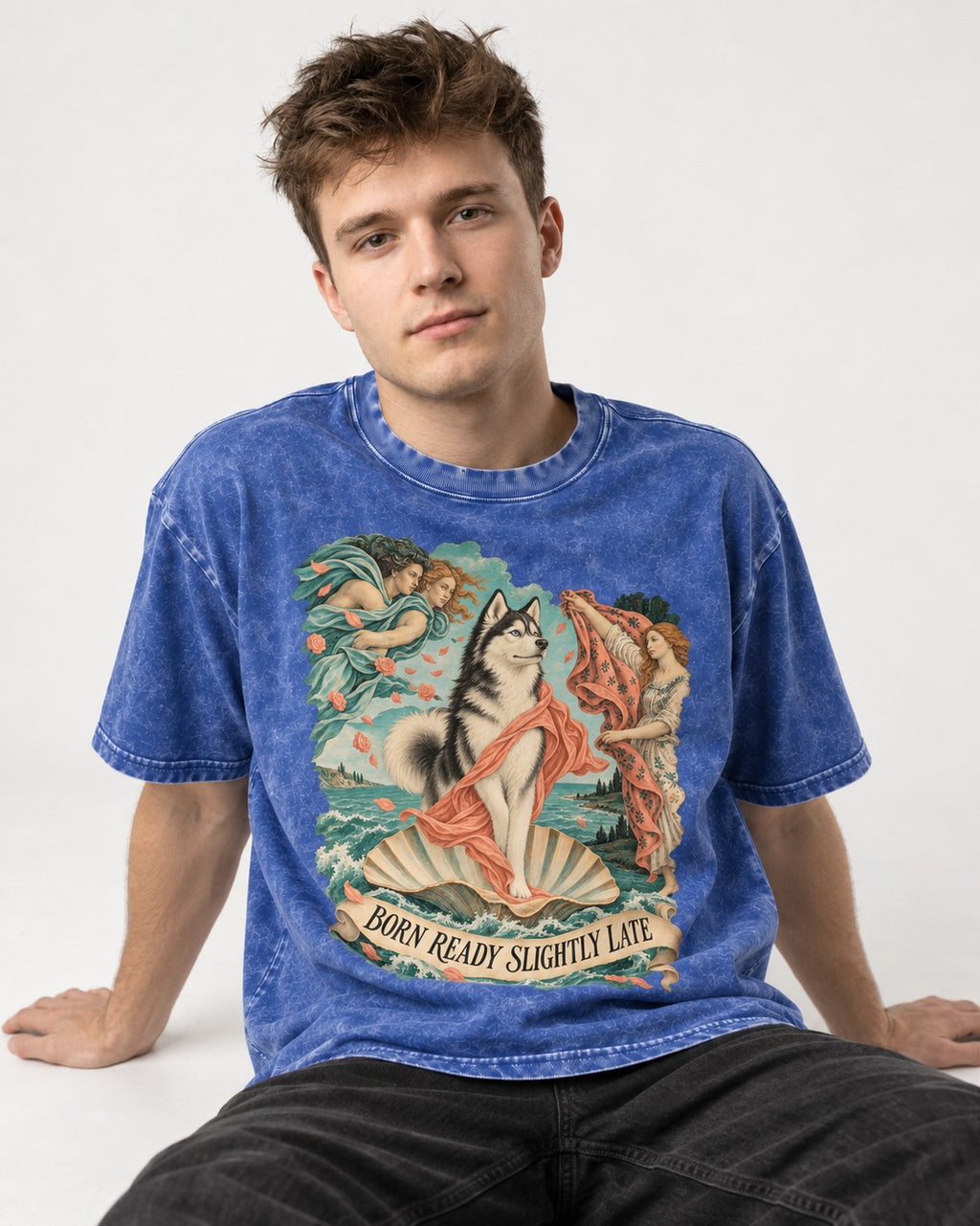 Husky Born Ready Slightly Late Renaissance Graphic Washed Tee in Royal Blue, worn by a seated model