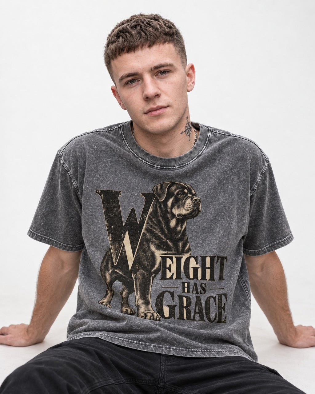 Rottweiler Weight Has Grace Washed Tee in Gray, worn by a seated model