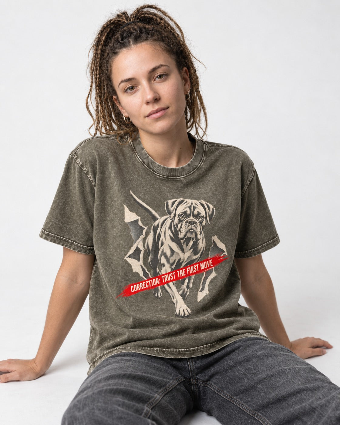 Mastiff Mismatch Boxer Needs Review Washed Tee in Army Green, worn by a seated model
